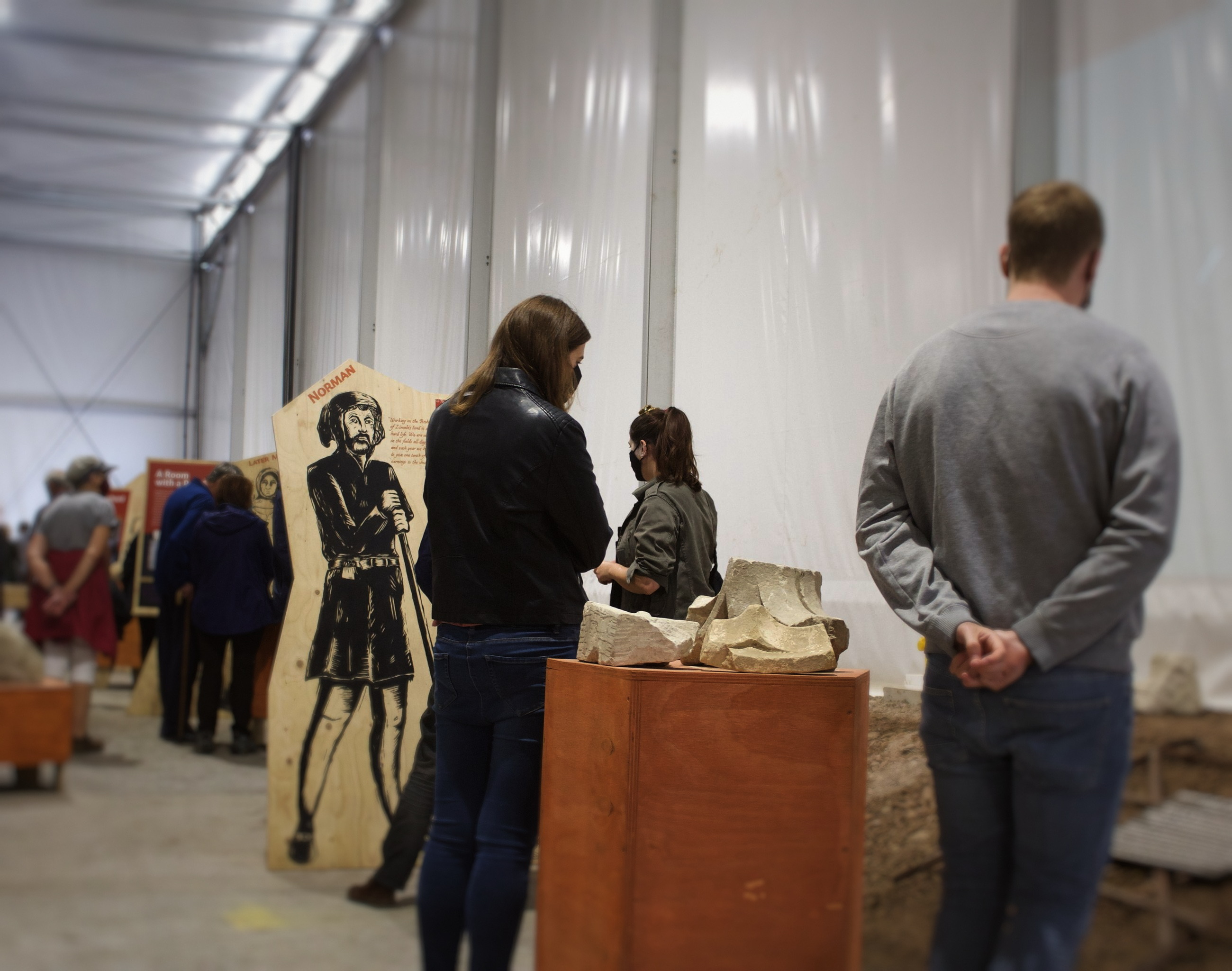 Visitors among the character stands.