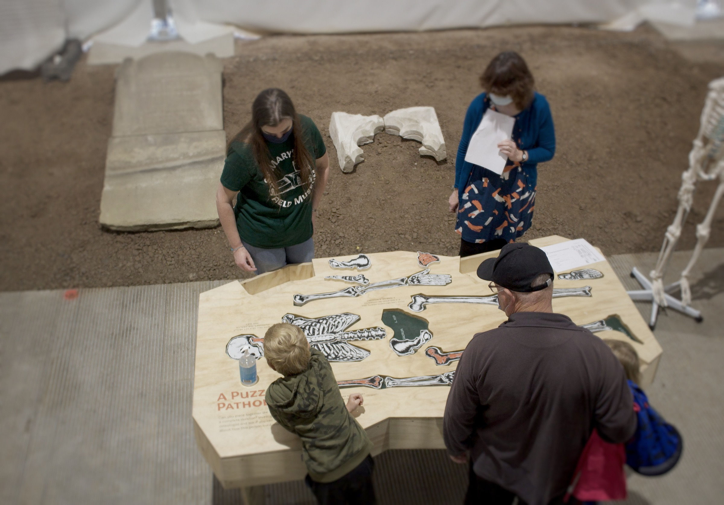 Visitors gathered around the pathology table.