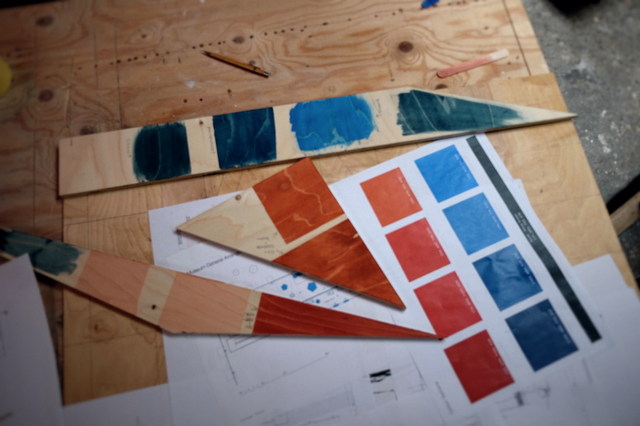 Colour swatches and panel proofs on plywood.