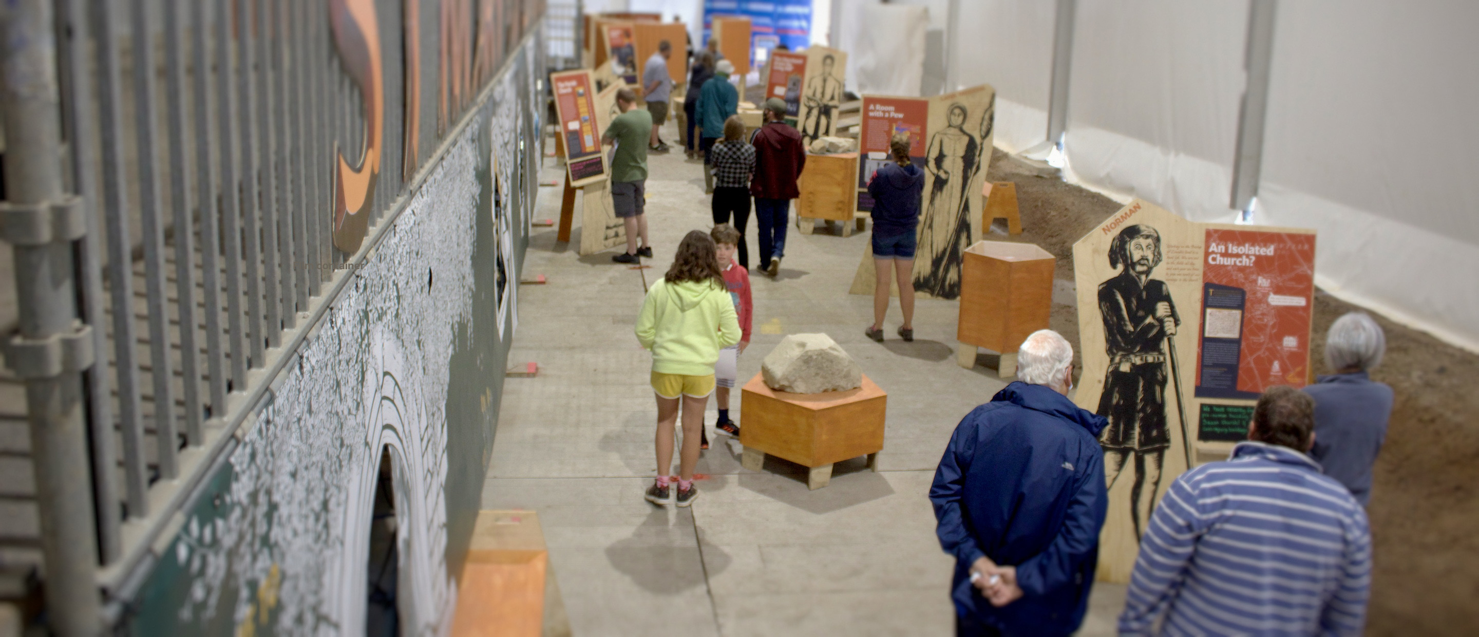 The field museum on site, plywood figures and panels inside the excavation shed.